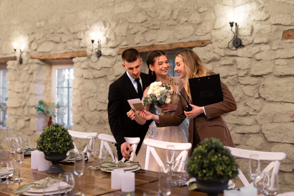 wedding planner with bride and groom